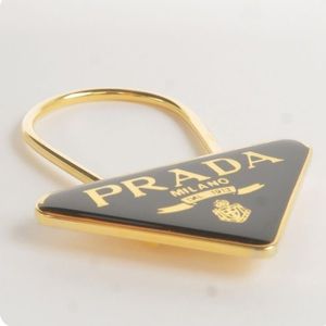 Authentic Prada Gold black triangle key chain. In Excellent condition